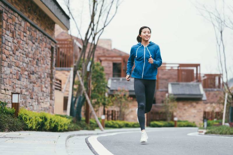 young-asian-woman-running-outdoors